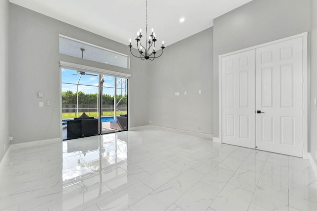 empty room featuring a notable chandelier