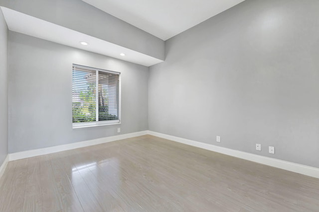 unfurnished room with light hardwood / wood-style floors