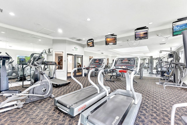 exercise room with carpet and crown molding