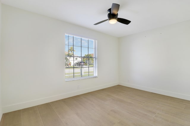 unfurnished room with ceiling fan and light wood-type flooring