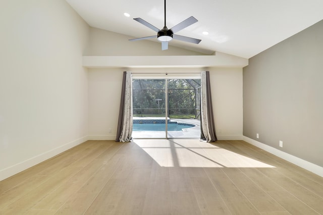 unfurnished room with ceiling fan, light hardwood / wood-style floors, and lofted ceiling