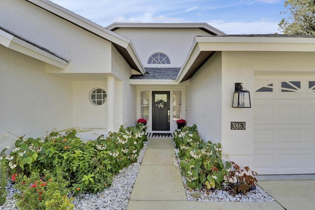 entrance to property featuring a garage