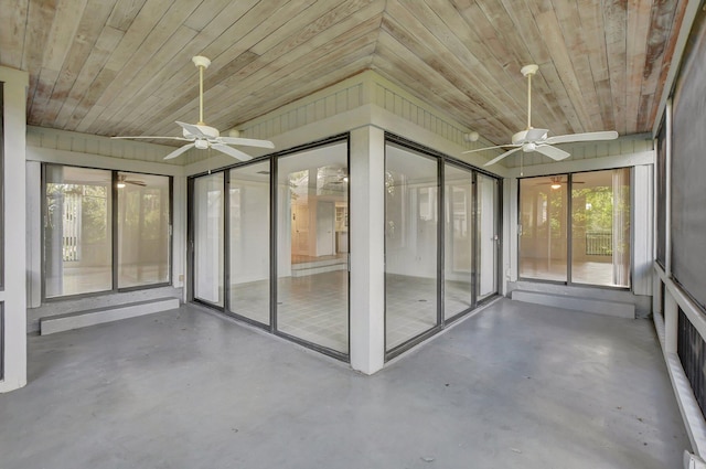 unfurnished sunroom with wood ceiling