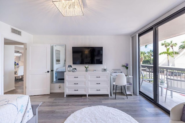 bedroom featuring access to outside and dark hardwood / wood-style floors