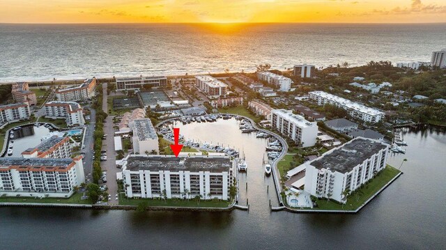 aerial view at dusk with a water view