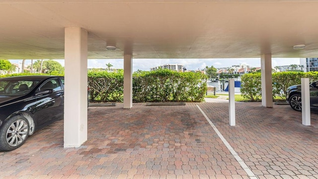 view of parking / parking lot with a carport