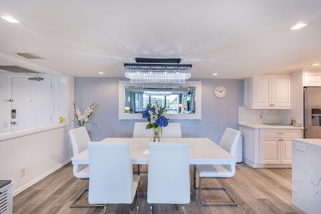 dining room featuring light wood-type flooring