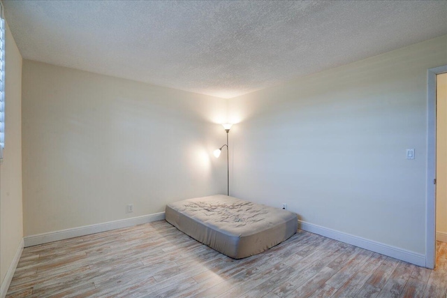 bedroom with light hardwood / wood-style flooring