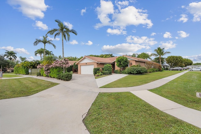 single story home featuring a garage and a front yard