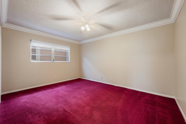 spare room with ceiling fan, ornamental molding, carpet flooring, and a textured ceiling