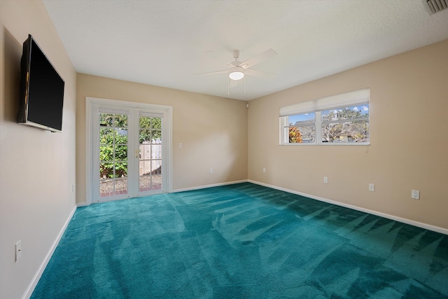 unfurnished room with carpet flooring, a wealth of natural light, and ceiling fan