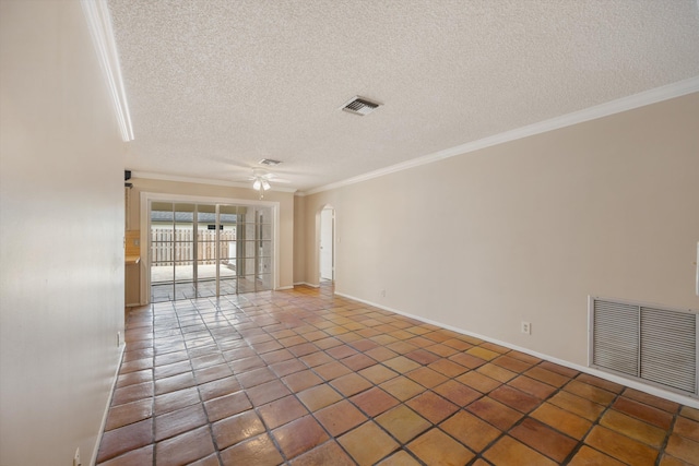 unfurnished room with crown molding, ceiling fan, a textured ceiling, and dark tile patterned floors