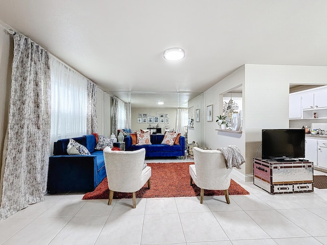 living room with light tile patterned floors and sink