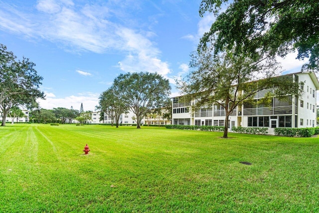 view of yard with a sunroom