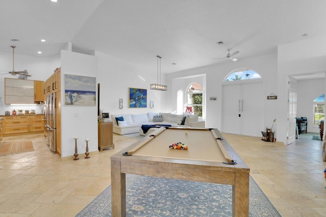 rec room featuring a towering ceiling, ceiling fan, and pool table