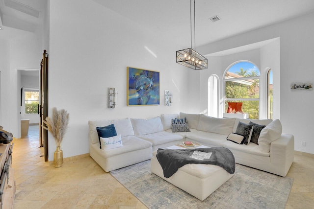 living room featuring a chandelier