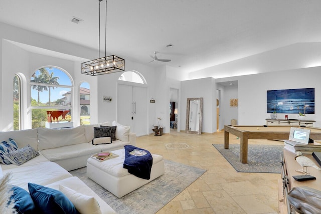 living room featuring ceiling fan and billiards