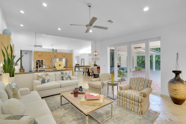 living room featuring french doors and ceiling fan