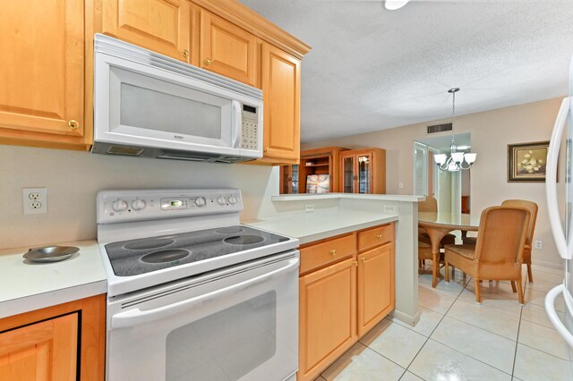 kitchen featuring sink, white appliances, light brown cabinetry, and light tile patterned flooring