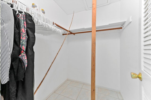 walk in closet featuring light tile patterned floors