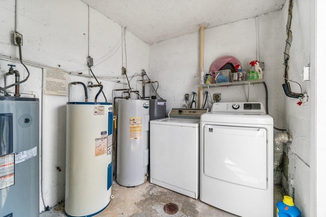 washroom with electric water heater and washing machine and clothes dryer