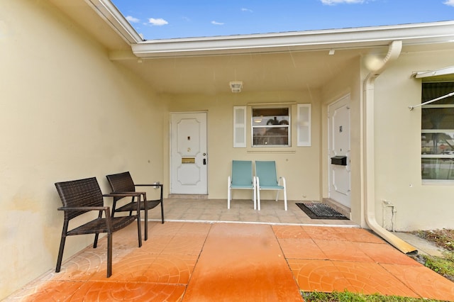 doorway to property with a patio area