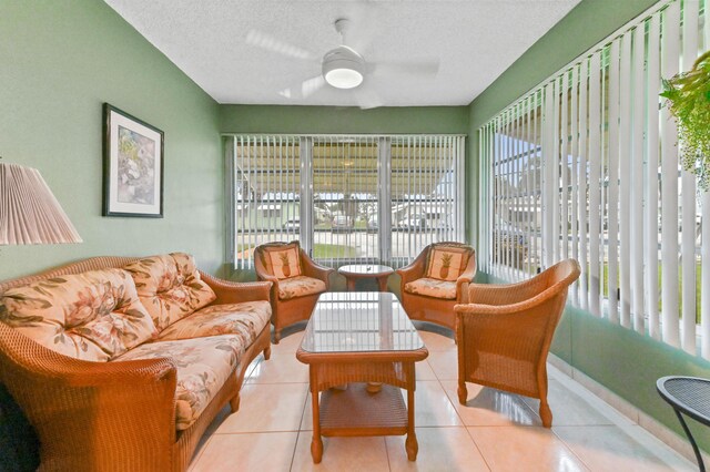 sunroom / solarium featuring ceiling fan