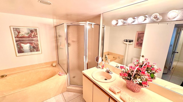 bathroom with tile patterned flooring, vanity, and independent shower and bath