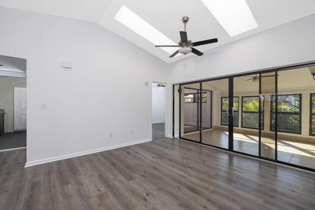 empty room featuring dark hardwood / wood-style flooring and french doors