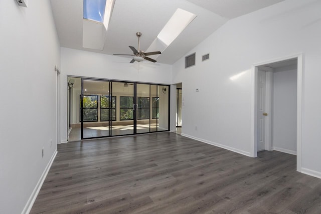 empty room featuring high vaulted ceiling, a skylight, ceiling fan, and dark hardwood / wood-style floors