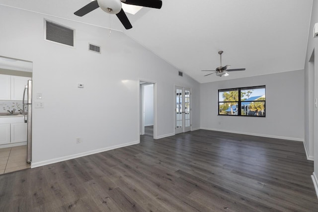 unfurnished living room featuring french doors, ceiling fan, and dark hardwood / wood-style floors