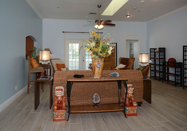 dining area with ornamental molding and ceiling fan