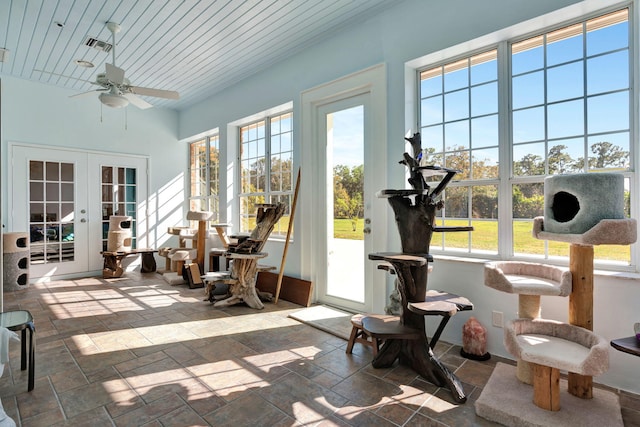 sunroom featuring french doors, wooden ceiling, and ceiling fan