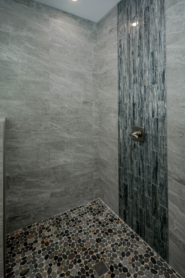 bathroom with tiled shower