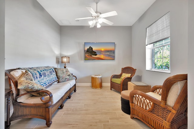 sitting room featuring ceiling fan and light hardwood / wood-style floors