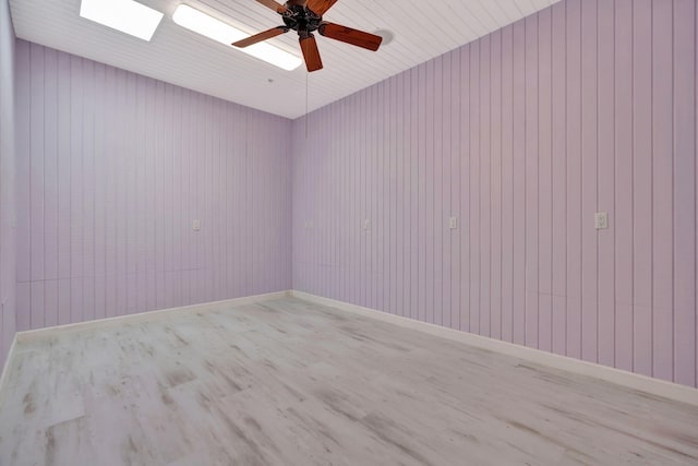 unfurnished room featuring ceiling fan and light wood-type flooring