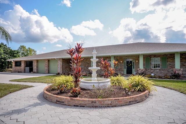 single story home with a garage