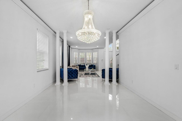 hall with decorative columns, light tile patterned floors, crown molding, and a notable chandelier