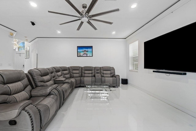 living room with ceiling fan and ornamental molding