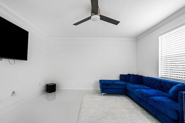 living room featuring baseboards, ceiling fan, ornamental molding, and a textured ceiling