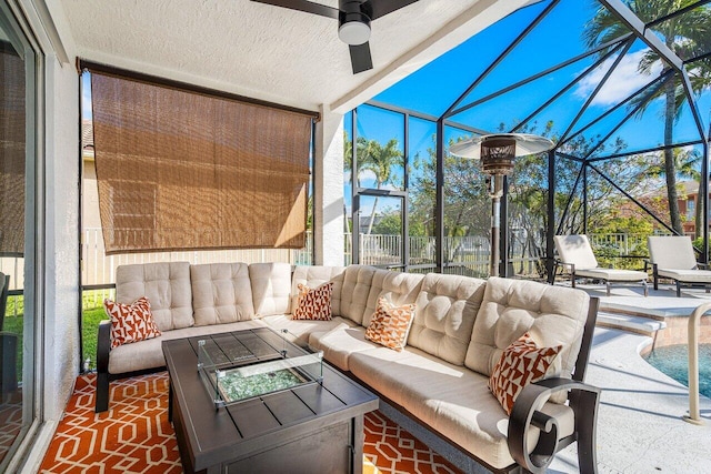 sunroom / solarium featuring ceiling fan