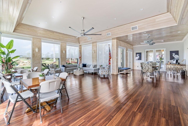 dining area featuring ceiling fan, dark hardwood / wood-style floors, and wood ceiling