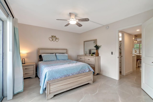 bedroom with ceiling fan and ensuite bath