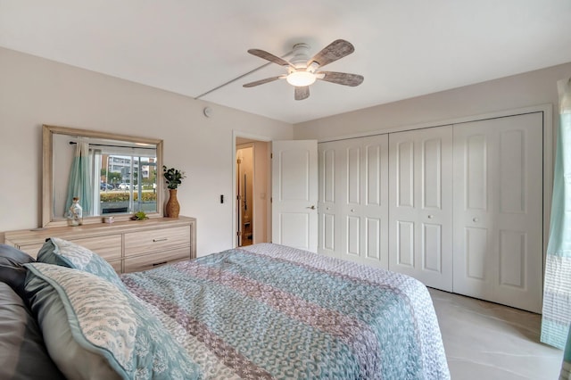 bedroom featuring ceiling fan and a closet