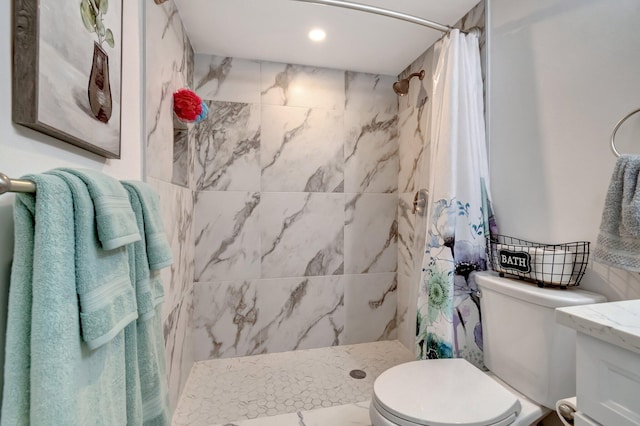 bathroom featuring curtained shower and toilet