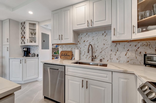 kitchen featuring white cabinetry, tasteful backsplash, dishwasher, electric panel, and sink