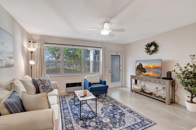 living room with ceiling fan and heating unit