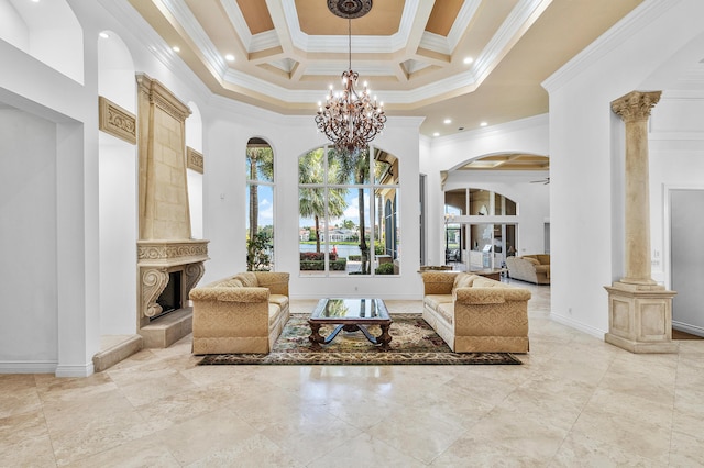 interior space with a large fireplace, a high ceiling, ornate columns, crown molding, and coffered ceiling