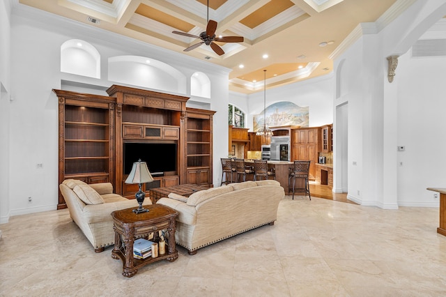 living room with a high ceiling, beam ceiling, ornamental molding, ceiling fan, and coffered ceiling