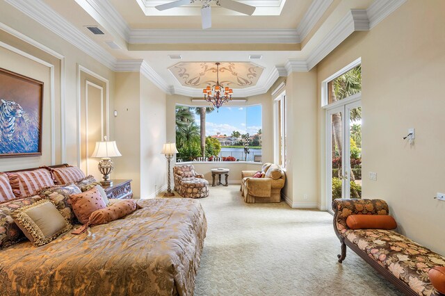 bedroom with a chandelier, ornamental molding, a tray ceiling, and carpet flooring